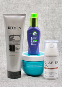 four curated salon-quality products, each carefully chosen to combat the effects of mineral-rich water on different hair types.