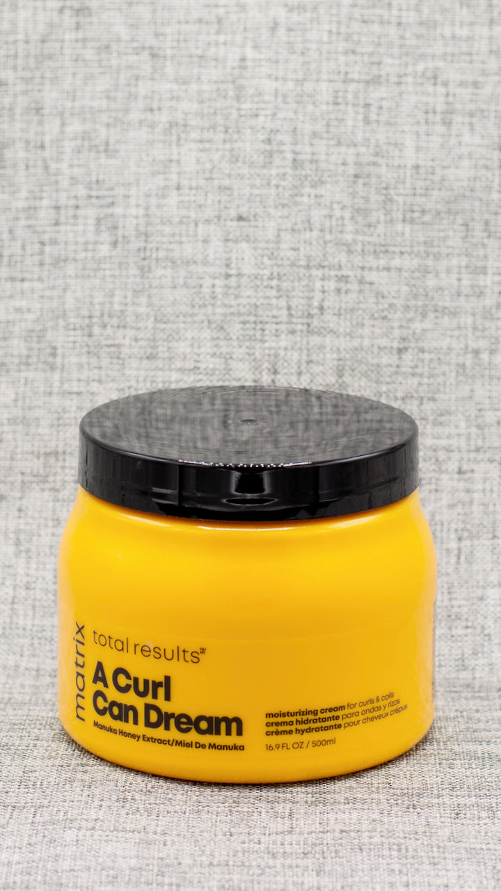 A Curl Can Dream Moisturizing Cream for curls; coils is a leave-in cream that provides moisture and definition, without flaking or crunch! Infused with Manuka honey extract, which acts as a natural humectant and adds moisture to hair, it is free of silicones, sulfates, parabens, mineral oil, petrolatum and paraffins.