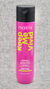 Matrix Keep Me Vivid Conditioner. Acidic conditioner deeply nourishes color-treated hair.  Deeply nourishes each strand without the weight. Glazing conditioner. Helps keep hair color sealed.