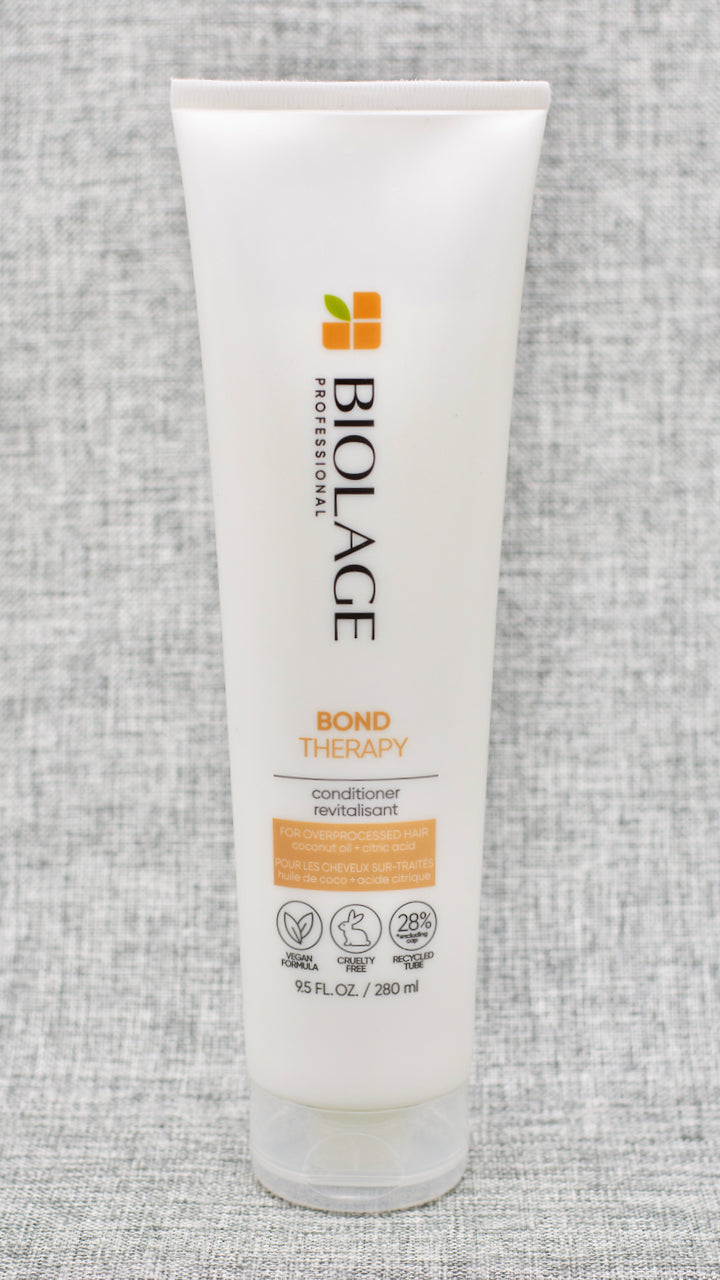 Biolage Bond Therapy Conditioner for overprocessed, damaged hair smooths, nourishes and builds bonds from the inside out. Ideal for medium to coarse overprocessed, damaged hair.

Conditioner for overprocessed, damaged hair that smooths, nourishes and builds bonds from the inside out.