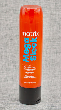 Matrix Mega Sleek Conditioner. Conditions to help control rebellious, unruly hair and manages frizz against humidity. The search for smooth, sleek hair is over thanks to Mega Sleek System. This anti-frizz, vegan-formulated conditioner with shea butter helps control rebellious, unruly hair and manages frizz against humidity for smoothness, leaving hair smooth, shiny and defrizzed, with up to 5x smoother hair.