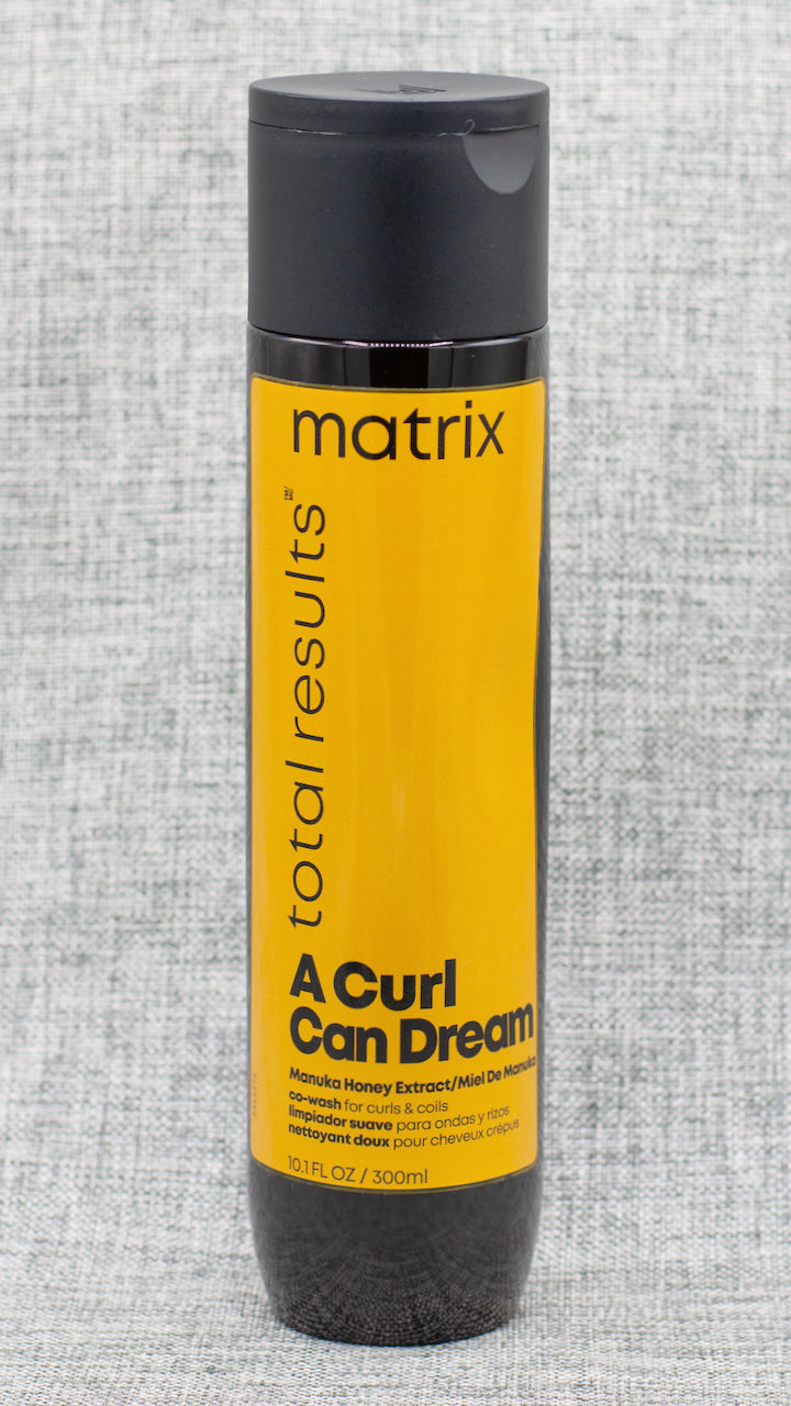 Matrix A Curl Can Dream Co-Wash is for curls and coils and infused with Manuka honey extract. This gentle cleansing conditioner is perfect for in-between wash days to revive curls.