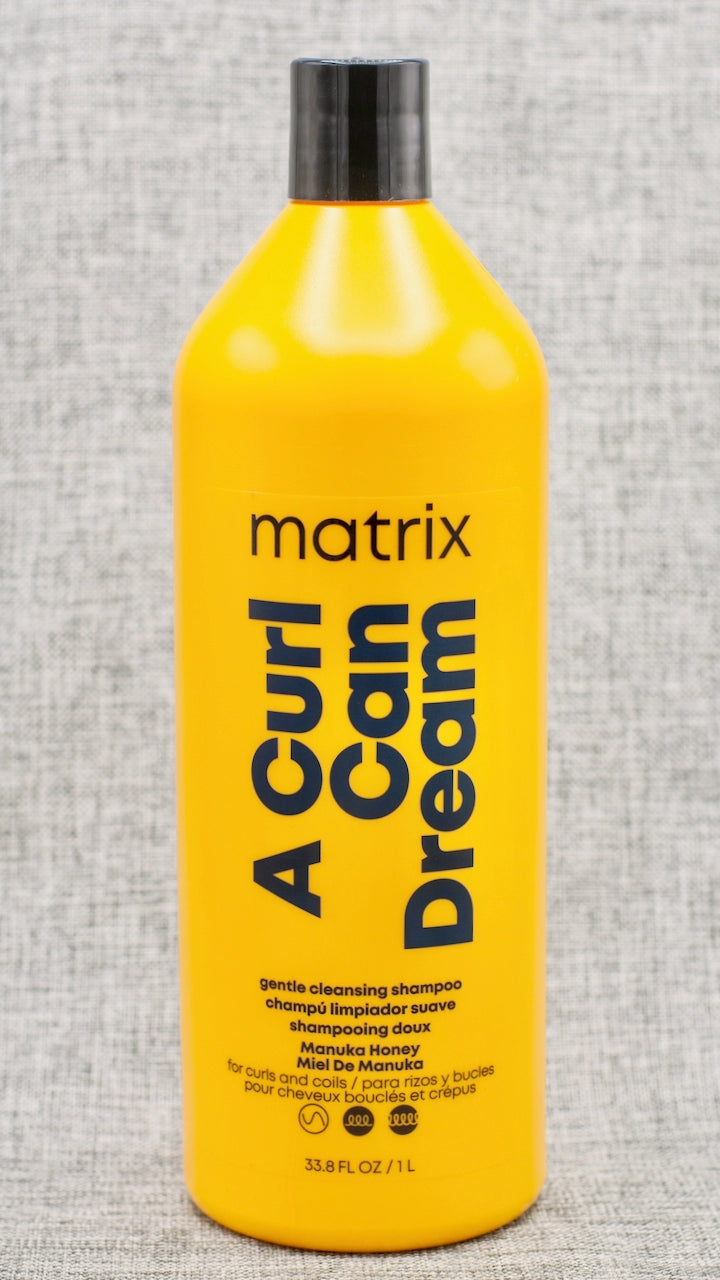 Shampoo for curls and coils, infused with Manuka honey extract. Matrix A Curl Can Dream Shampoo is for curls and coils, infused with Manuka honey extract. A deep cleansing shampoo perfect for wash day to remove build up, while still preserving your curls!