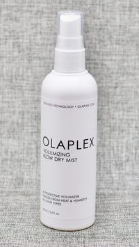 Olaplex Volumizing Blow Dry Mist, infused with patented OLAPLEX Bond Building Technology, is a reparative blow-dry mist that provides lasting body and bounce and also protects hair from heat, leaving it visibly soft, shiny, and healthy.